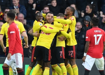Watford's Senegalese midfielder Ismaila Sarr (C) celebrates with teammates after scoring the opening goal of the English Premier League football match between Watford and Manchester United at Vicarage Road Stadium in Watford, north of London on December 22, 2019. (Photo by DANIEL LEAL-OLIVAS / AFP) / RESTRICTED TO EDITORIAL USE. No use with unauthorized audio, video, data, fixture lists, club/league logos or 'live' services. Online in-match use limited to 120 images. An additional 40 images may be used in extra time. No video emulation. Social media in-match use limited to 120 images. An additional 40 images may be used in extra time. No use in betting publications, games or single club/league/player publications. /