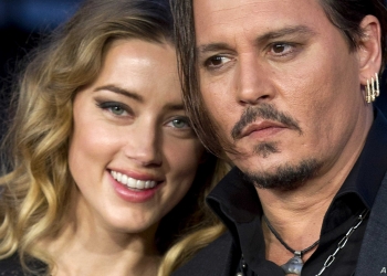 (FILES) In this file photo taken on October 11, 2015 US actors Johnny Depp (R) and wife Amber Heard (L) pose for photographers on the red carpet for the premiere of Black Mass during the BFI London Film Festival in central London on October 11, 2015. - The libel case brought by Hollywood actor Johnny Depp against A British news group is due to open at Britain's High Court on July 7, 2020. Depp, 57, is suing News Group Newspapers (NGN) over an April 2018 article in The Sun newspaper that claimed he had been violent to his former wife, the actress Amber Heard. He has strenuously denied the claims. (Photo by JUSTIN TALLIS / AFP)
