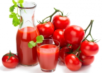 tomatoes and tomato juice on white background