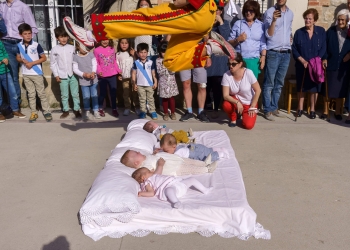 The 'Colacho' (man representing the devil) jumps over babies during 'El salto del Colacho', the baby jumping festival in the village of Castrillo de Murcia, near Burgos on June 3, 2018
Baby jumping (El Colacho) is a traditional Spanish practice dating back to 1620 that takes place annually to celebrate the Catholic feast of Corpus Christi. During the act - known as El Salto del Colacho (the devil's jump) or simply El Colacho - men dressed as devils jump over babies born in the last twelve months of the year who lie on mattresses in the street. / AFP PHOTO / CESAR MANSO