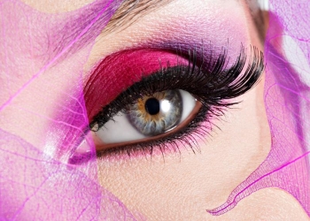 Closeup female eye with  beautiful fashion bright pink makeup