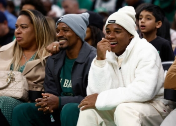 BOSTON, MA - DECEMBER 12:  Brazilian soccer player Endrick shares a laugh with his father Douglas Sousa as they sit courtside for the game between the Boston Celtics and the Cleveland Cavaliers at TD Garden on December 12, 2023 in Boston, Massachusetts. NOTE TO USER: User expressly acknowledges and agrees that, by downloading and/or using this Photograph, user is consenting to the terms and conditions of the Getty Images License Agreement. (Photo By Winslow Townson/Getty Images)