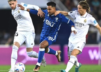RABAT, MOROCCO - FEBRUARY 11: Salem Aldawsari of Al Hihal holds off Federico Valverde and Luka Modric of Real Madrid during the FIFA Club World Cup Morocco 2022 Final match between Real Madrid and Al Hilal at Prince Moulay Abdellah on February 11, 2023 in Rabat, Morocco. (Photo by David Ramos - FIFA/FIFA via Getty Images)